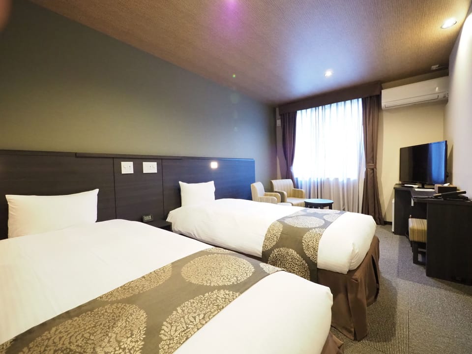 Desk, blackout drapes, WiFi (free), bed sheets