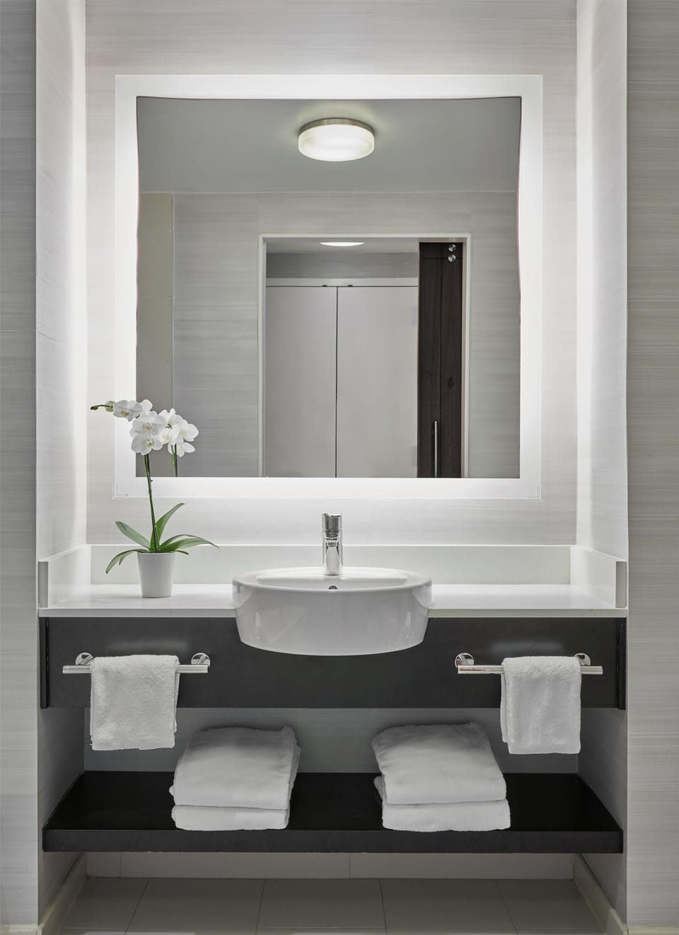 Designer toiletries, hair dryer, towels