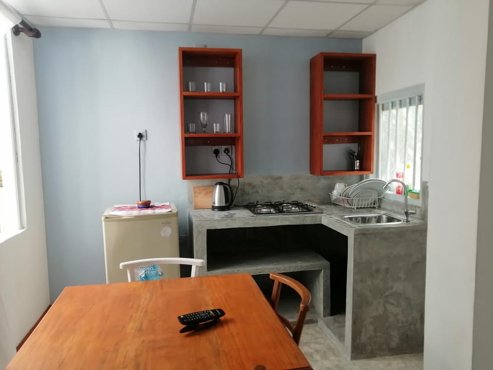 Basic Apartment, 2 Bedrooms | Private kitchen | Cookware/dishes/utensils, dining tables