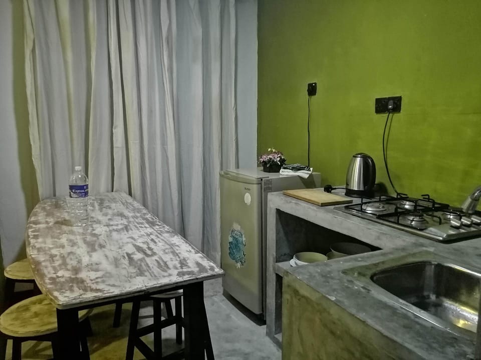 Basic Apartment, 2 Bedrooms | Private kitchen | Cookware/dishes/utensils, dining tables