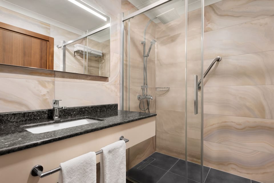 Shower, free toiletries, hair dryer, slippers