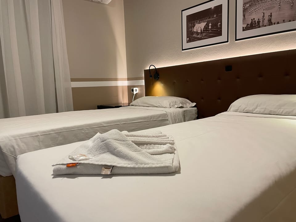Standard Twin Room | Minibar, desk, blackout drapes, iron/ironing board