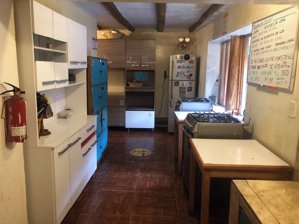 Coffee/tea maker, full-size fridge, shared microwave, oven