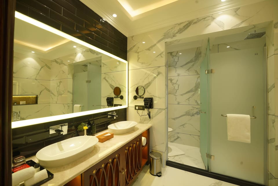 Royal Suite, 1 King Bed | Bathroom | Combined shower/tub, eco-friendly toiletries, hair dryer, bathrobes
