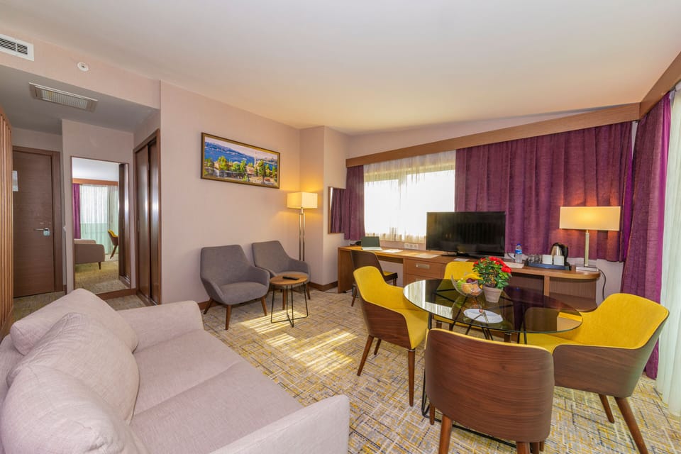 Deluxe Suite, Lake View | Minibar, in-room safe, desk, soundproofing