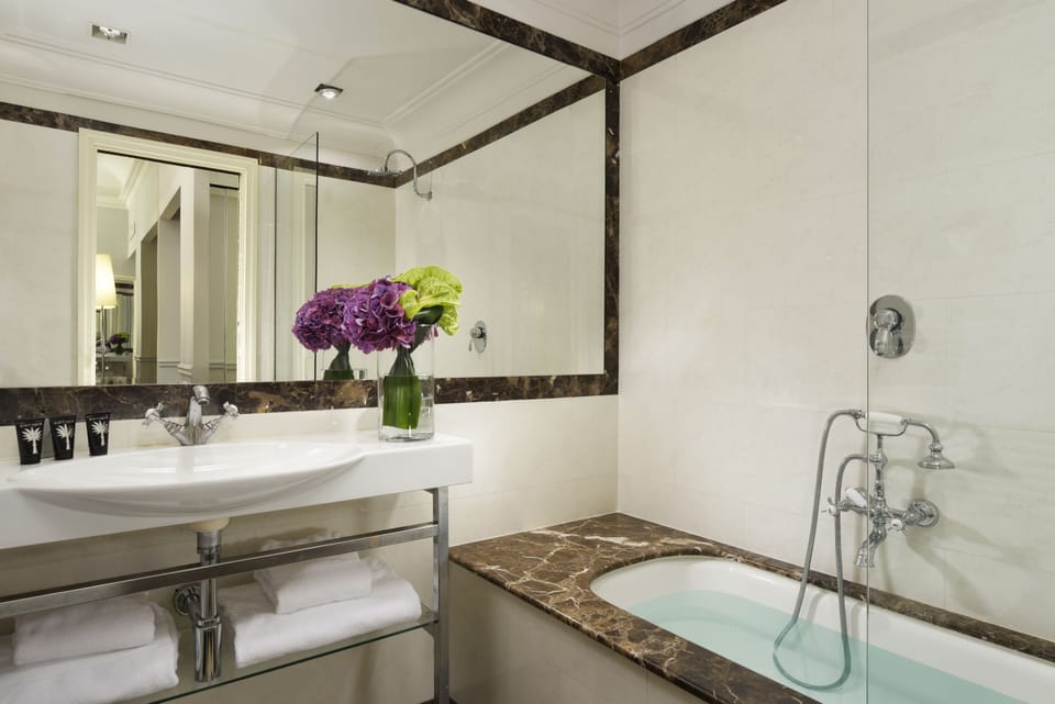 Eco-friendly toiletries, hair dryer, slippers, towels