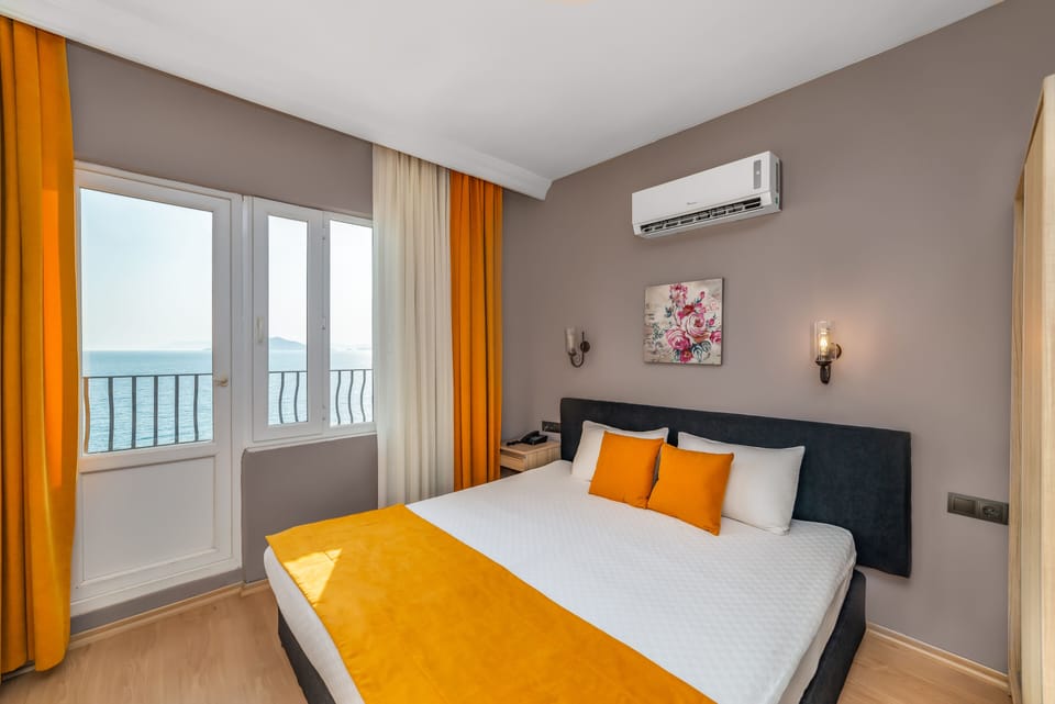 Standard Double Room, Sea View | Minibar, in-room safe, desk, free WiFi