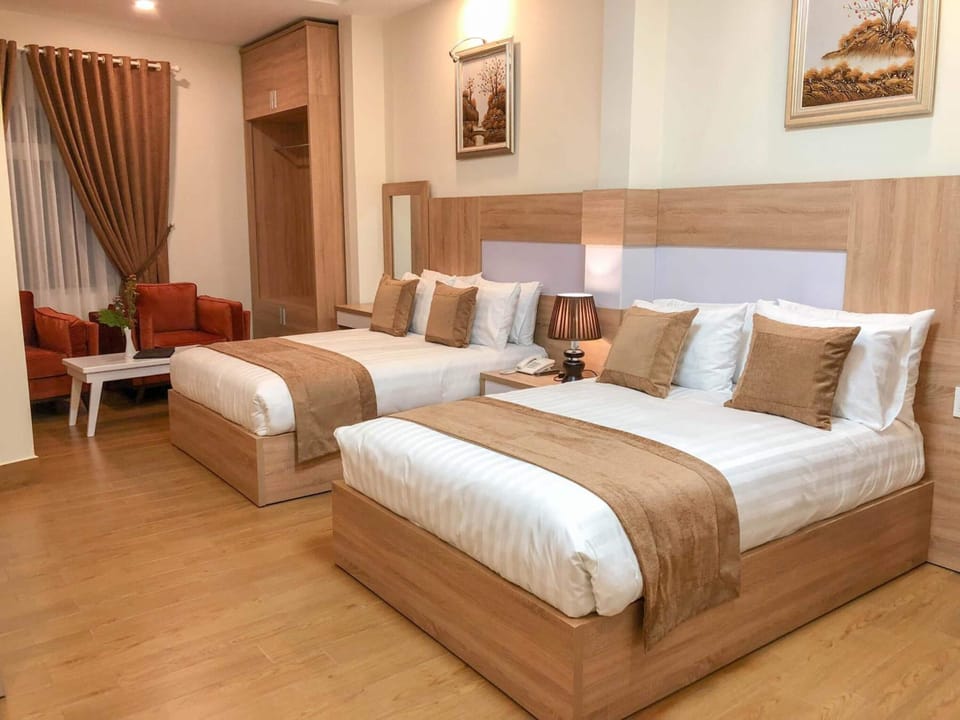 Deluxe Triple Room, 2 Double Beds | In-room safe, desk, free WiFi