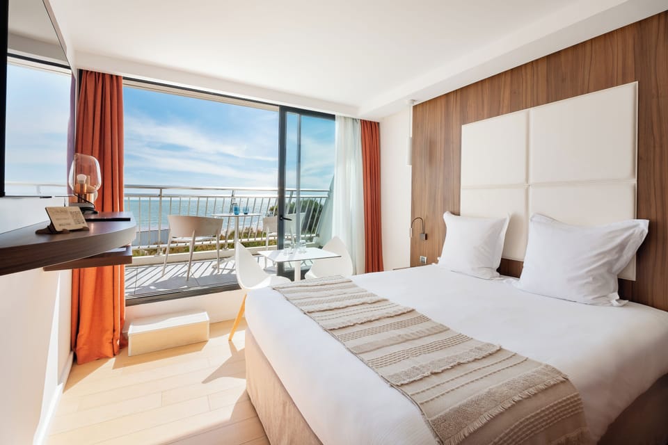 Double Room, Balcony, Sea View | Premium bedding, minibar, in-room safe, blackout drapes