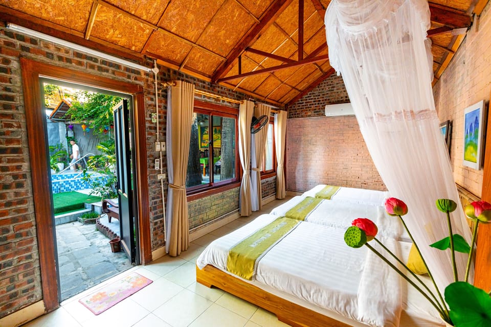 Comfort Triple Room, 1 Bedroom, Garden View | Minibar, desk, laptop workspace, blackout drapes