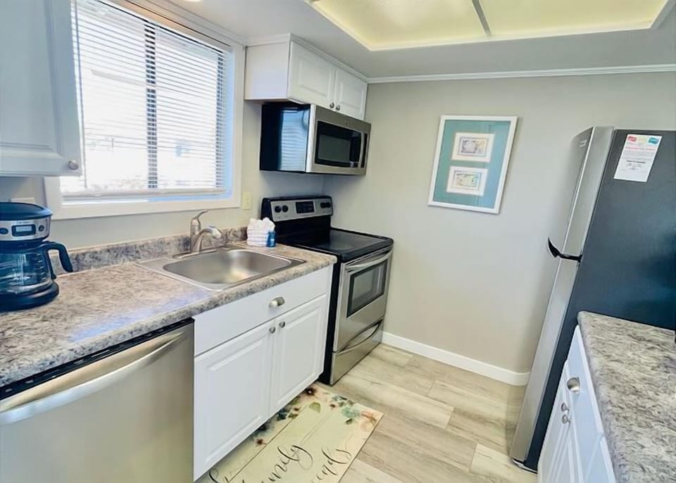 Your fully equipped kitchen features granite countertops, stainless steel appliances, and everything you need to create memorable meals during your stay.