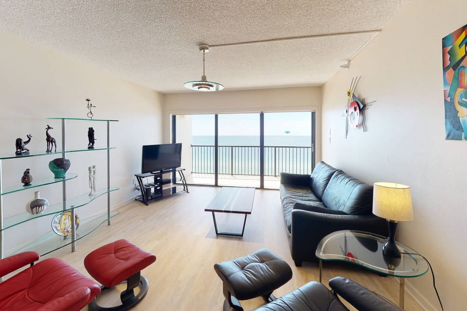 Living Room has a Queen Sleep Sofa, TV with DVDs Available,  and an Incredible View of the Gulf of Mexico.