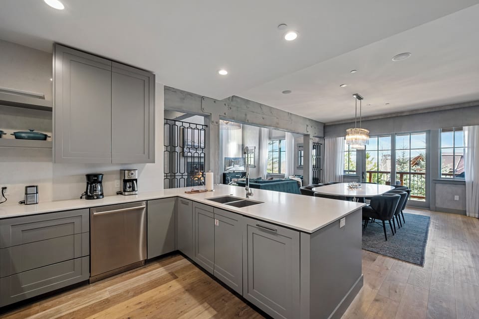 Cook comfortably in your sleek modern kitchen with spacious countertops, premium appliances, and an open layout flowing into the stylish dining area.