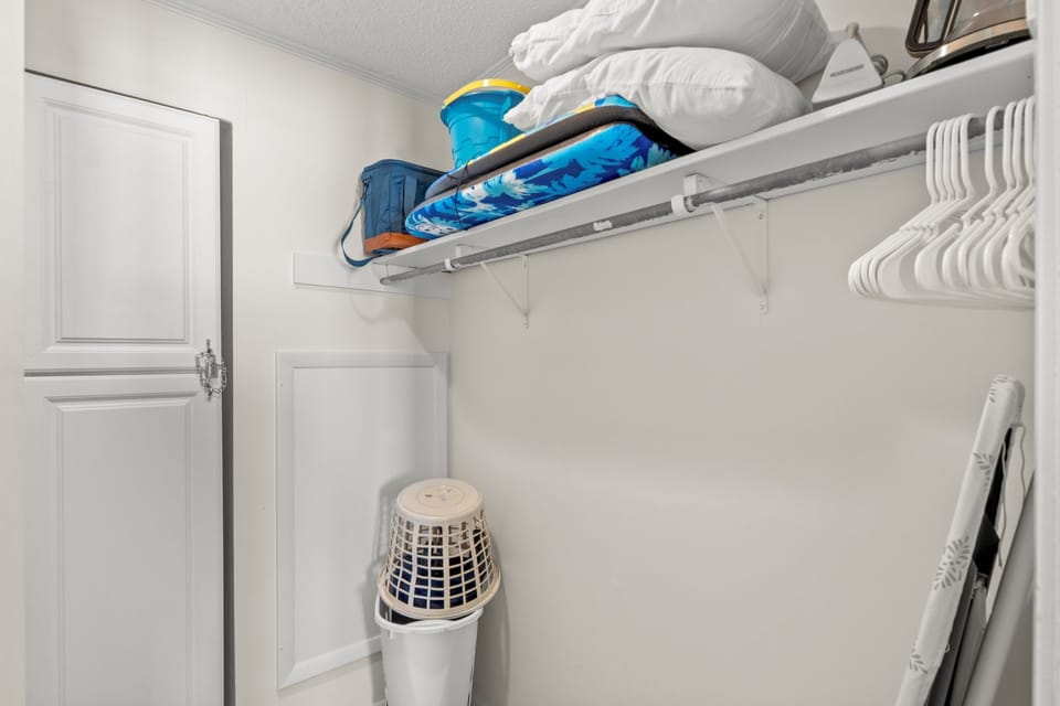 Your private walk-in closet keeps your belongings organized with ample shelving and hanging space for a comfortable stay.