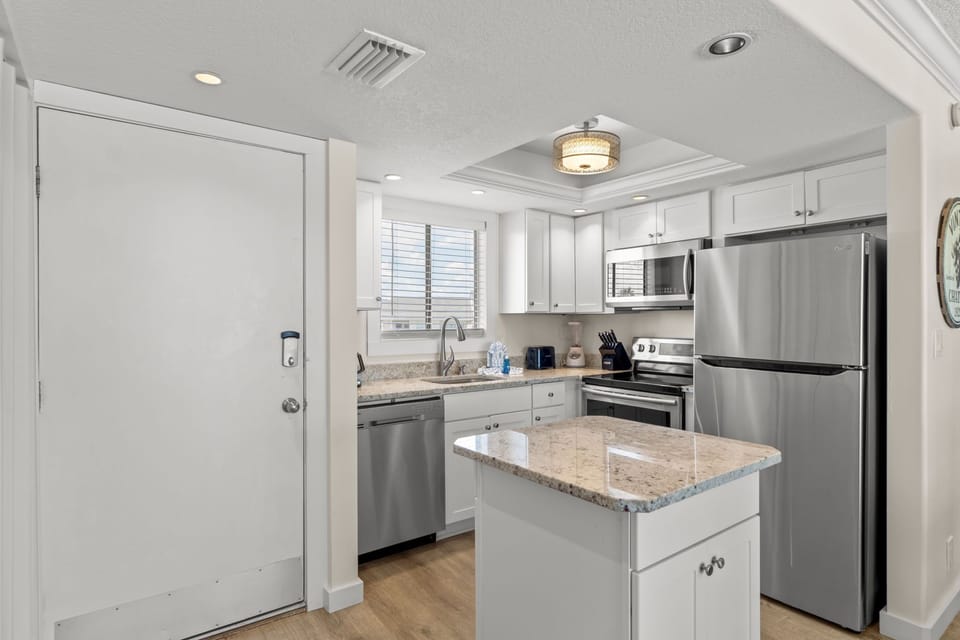 Your fully equipped kitchen features granite countertops, stainless steel appliances, and everything needed for memorable meals.