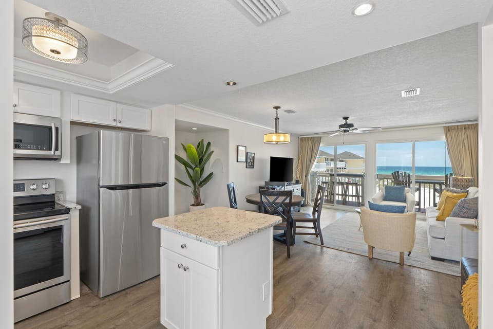 You'll love the open-concept living with stunning ocean views from your private balcony, modern kitchen, and bright coastal elegance throughout.