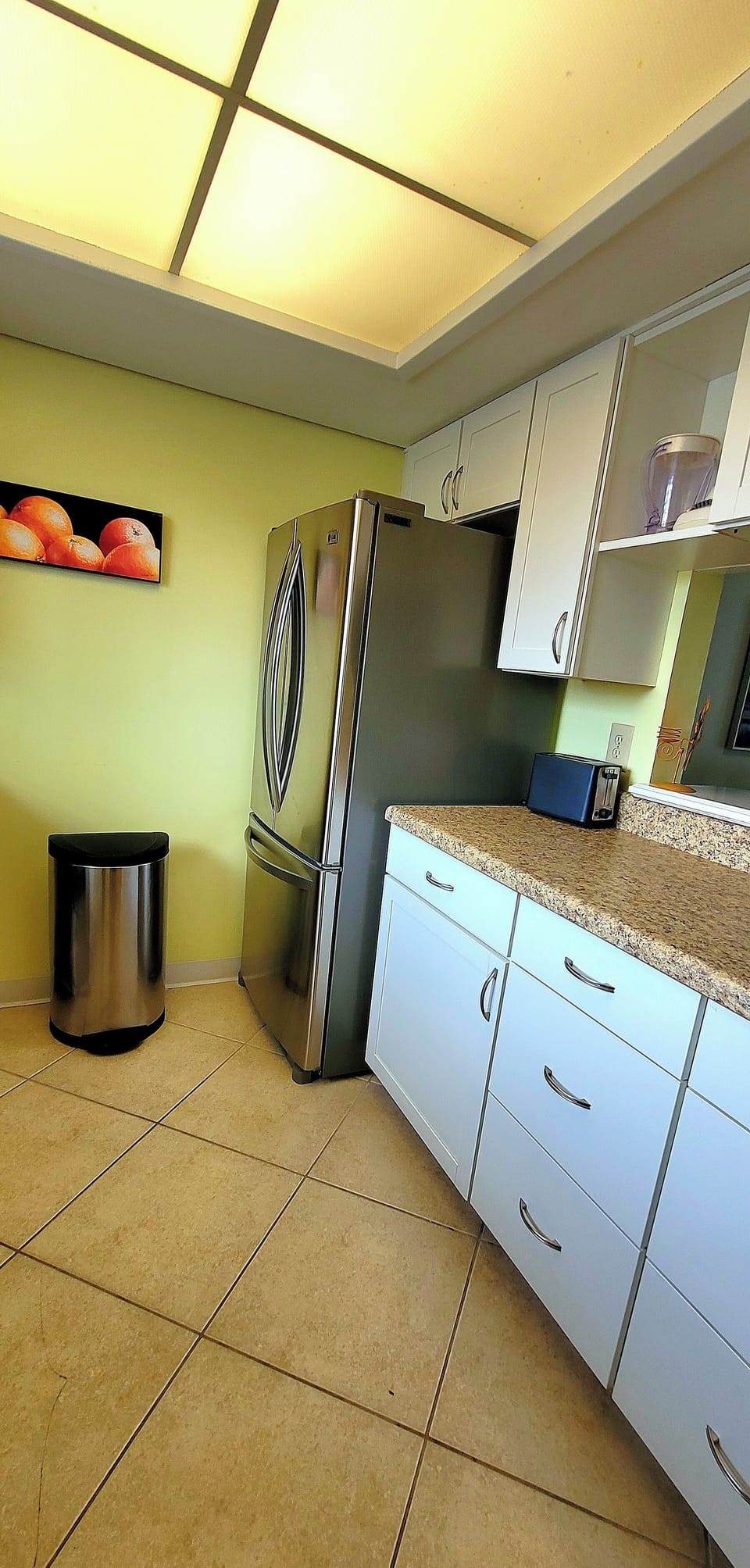 Cook with ease in your fully equipped kitchen featuring stainless steel appliances, granite countertops, and abundant cabinet space.
