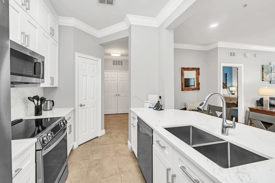 The kitchen features upgraded appliances and granite countertops