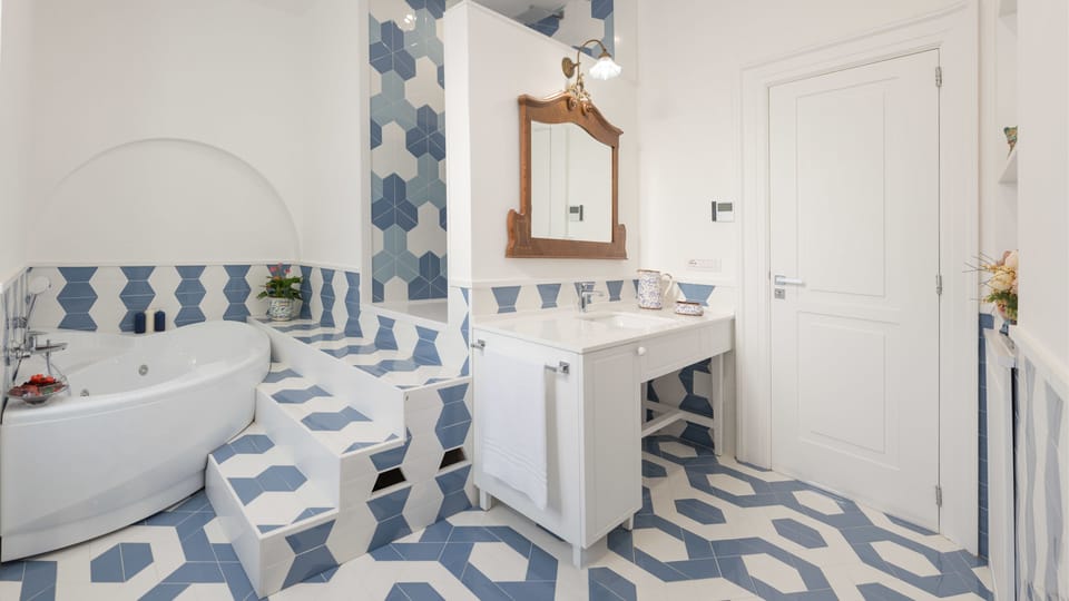 Junior Suite, Terrace, Garden View | Bathroom | Designer toiletries, hair dryer, slippers, bidet