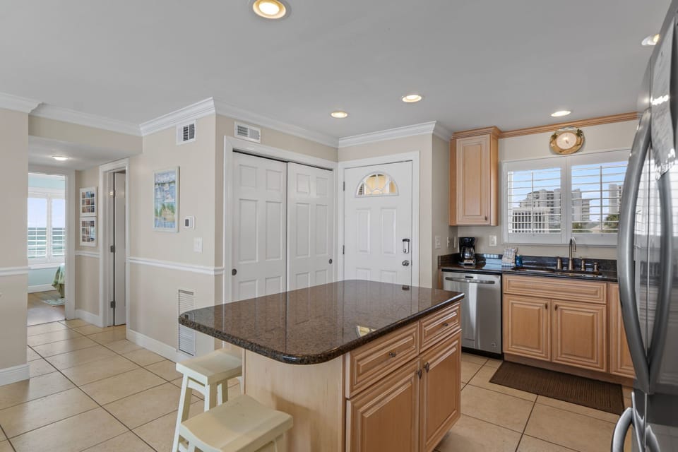Your spacious kitchen island becomes the heart of your stay, perfect for morning coffee or casual meals together.