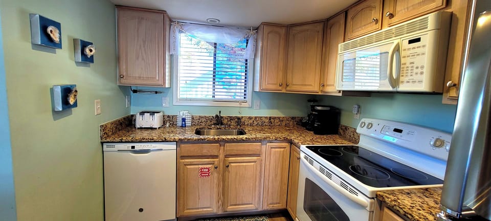 Your fully equipped kitchen features granite countertops, modern appliances, and everything you need to prepare meals during your stay.
