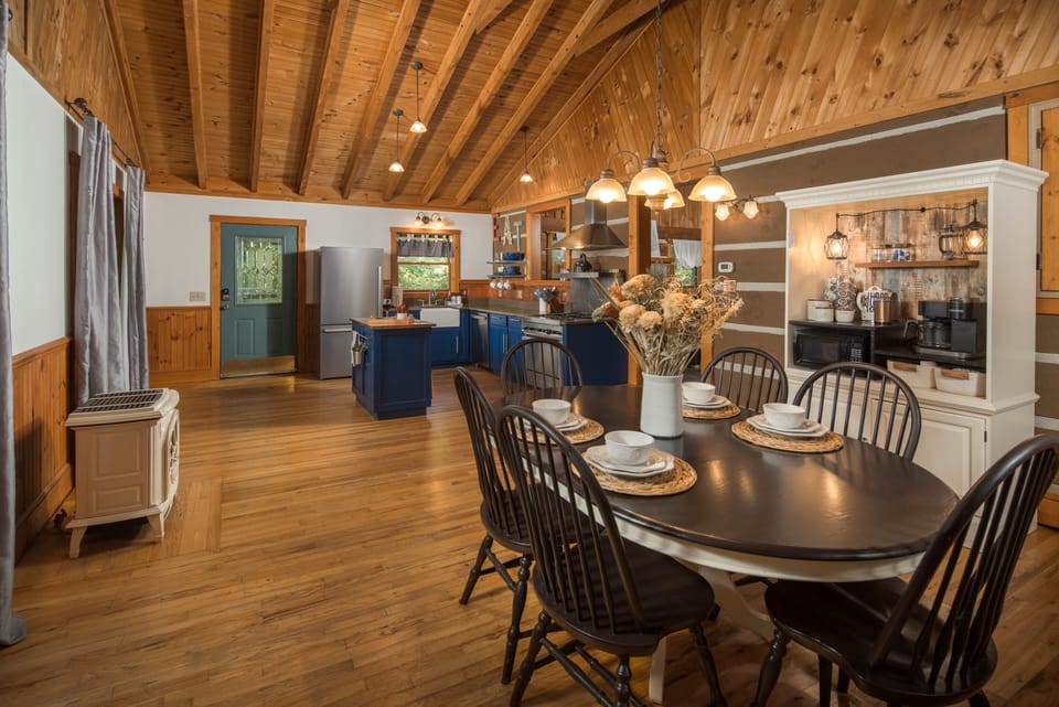 The large open kitchen and dining room leads into the living room