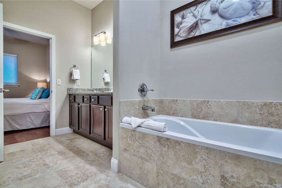 Master bath with dual vanities and soaking tub
