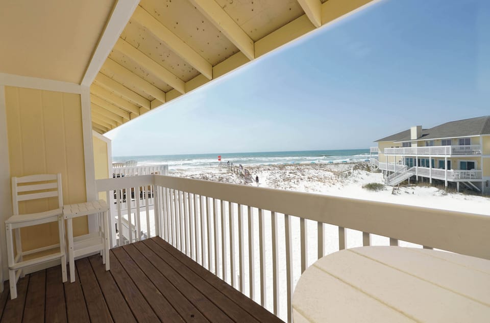 Step onto your private balcony and breathe in the ocean breeze while watching waves roll onto pristine white sand.