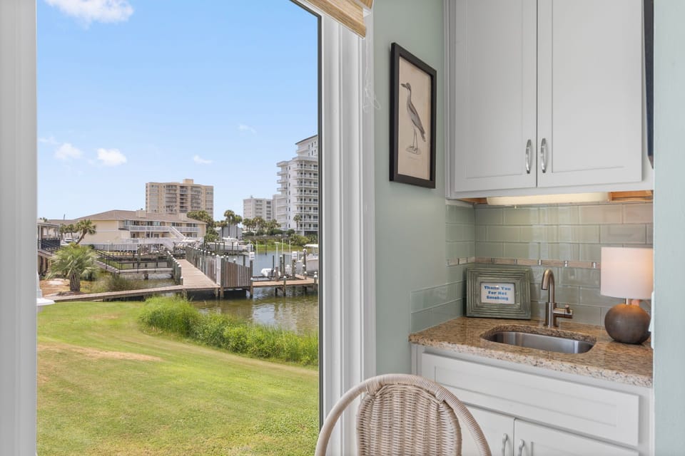 Your compact kitchen offers everything you need, with a peaceful waterfront view to inspire your morning coffee routine.