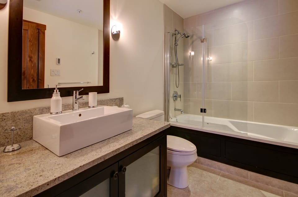King bedroom in-suite bathroom with bath-shower