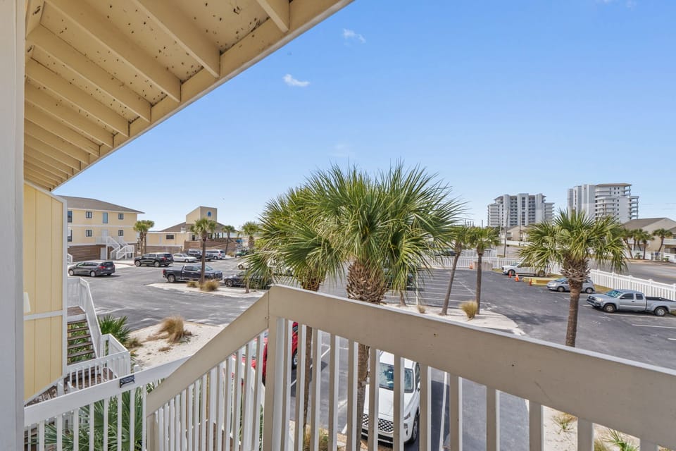 Step onto your private balcony and breathe in the coastal air while enjoying views of swaying palm trees.