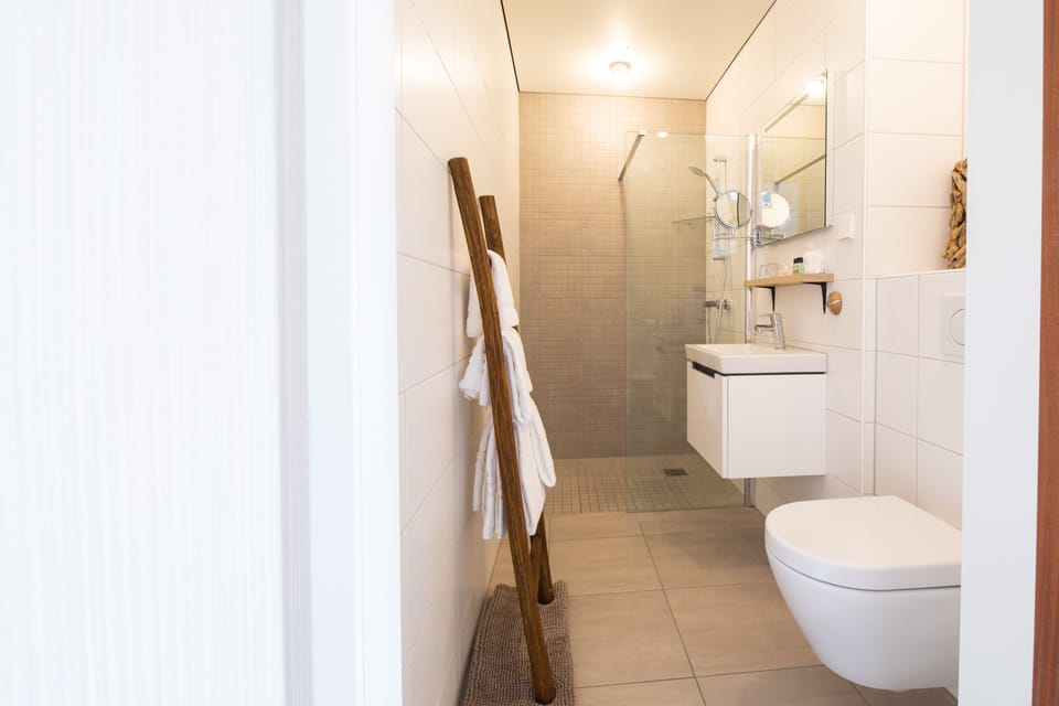 Designer toiletries, hair dryer, bathrobes, towels