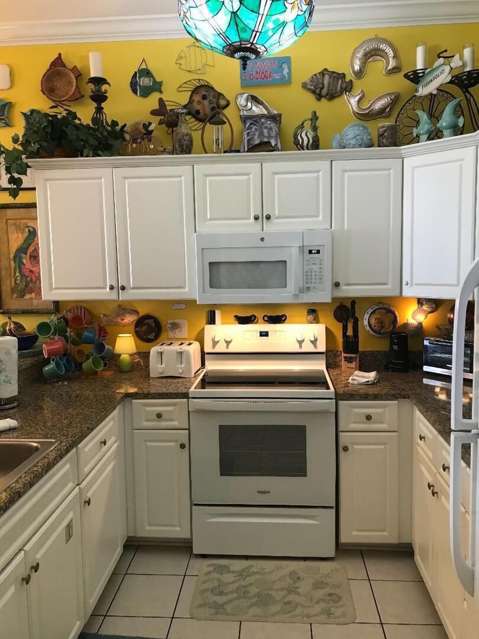 Kitchen Glass top stove and Microwave oven. Kitchen has dishwasher also.
