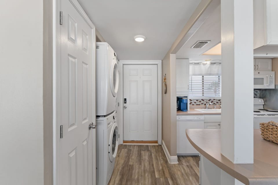 Step into your bright open-plan space where modern convenience meets home comfort, featuring in-unit laundry and a fully equipped kitchen.