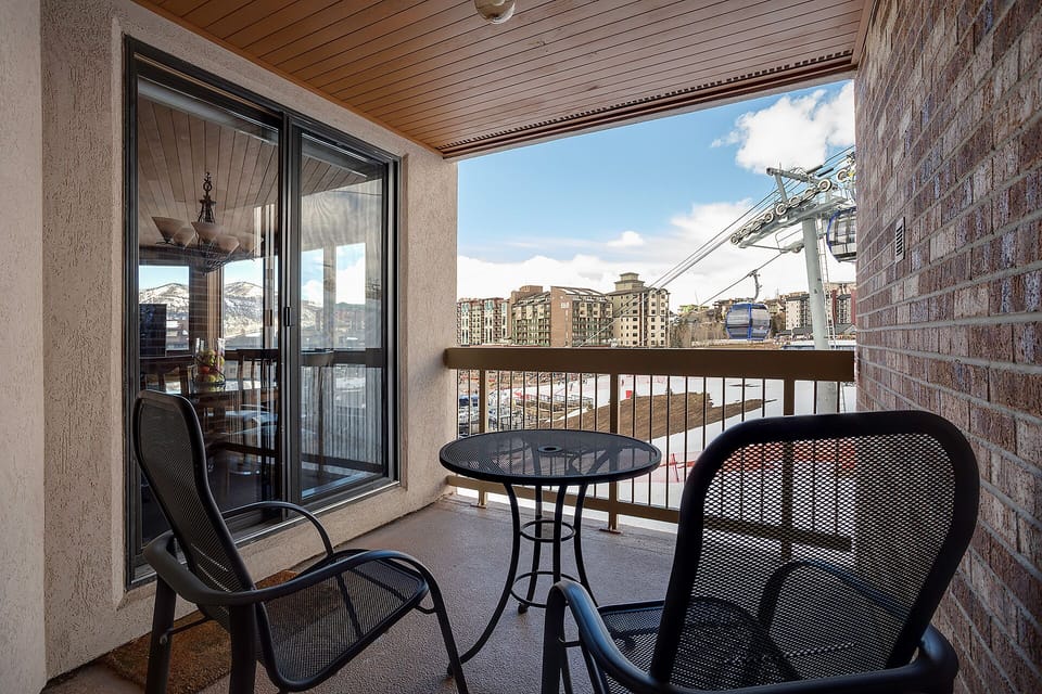 Your private balcony offers city views and fresh mountain air. Relax with morning coffee at your bistro table, overlooking vibrant neighborhoods below.
