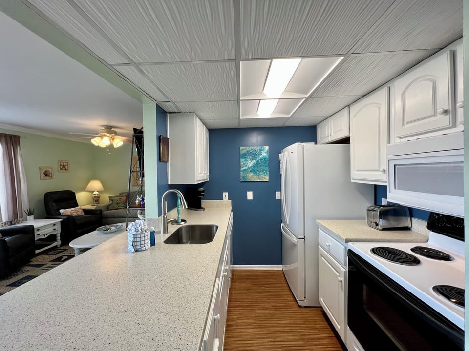 Your fully equipped kitchen features granite countertops, modern appliances, and everything you need to prepare delicious meals during your stay.