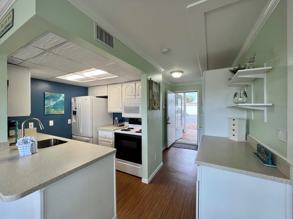 Your fully equipped kitchen features modern appliances and granite countertops, perfect for preparing meals during your stay.