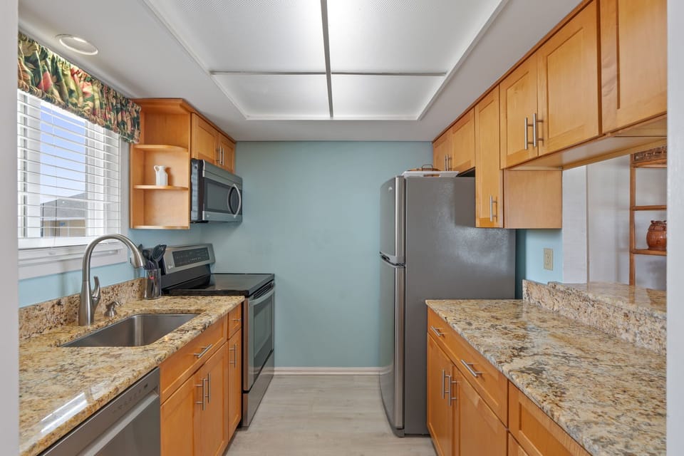 Cook up memorable meals in your fully equipped galley kitchen with granite counters and stainless steel appliances.