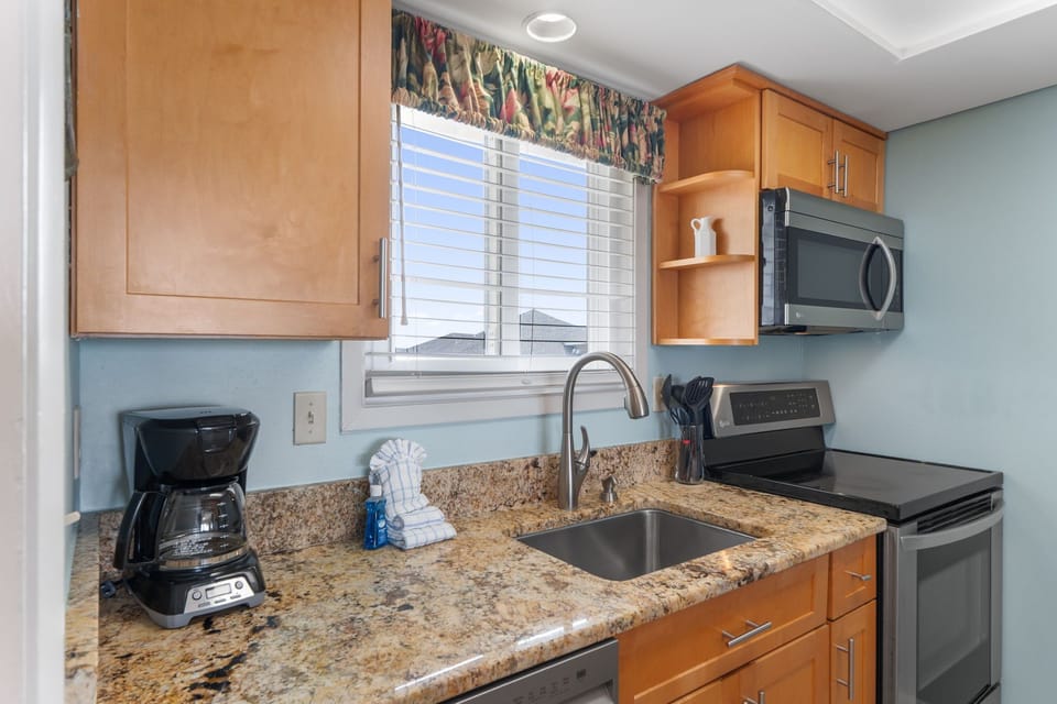 Your fully-equipped kitchen features granite counters, stainless appliances, and everything needed to prepare meals during your stay.