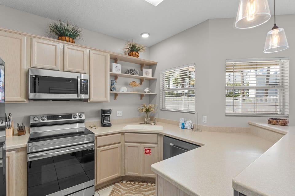 Your fully equipped kitchen invites you to cook with ease, featuring modern appliances, ample counter space, and bright natural light streaming through large windows.