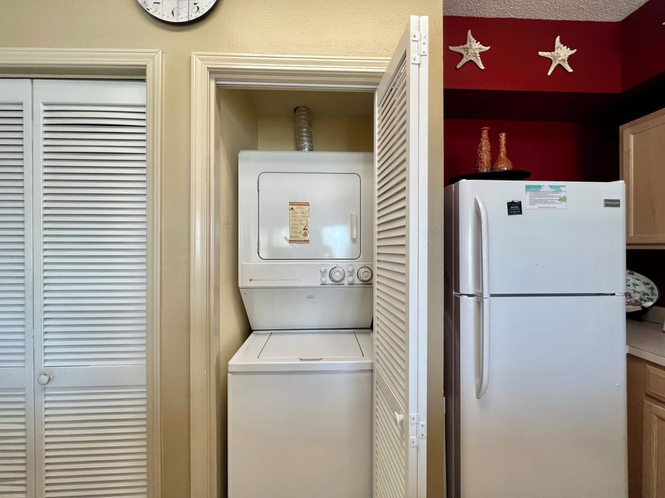 Your convenience matters - stacked washer and dryer tucked neatly in a closet, plus a full-size refrigerator for all your vacation needs.