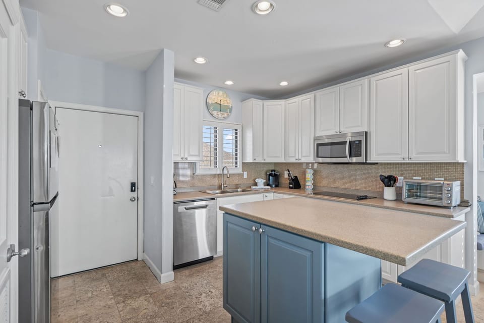 Your fully equipped kitchen awaits with modern appliances, granite counters, and everything you need to create memorable meals during your stay.