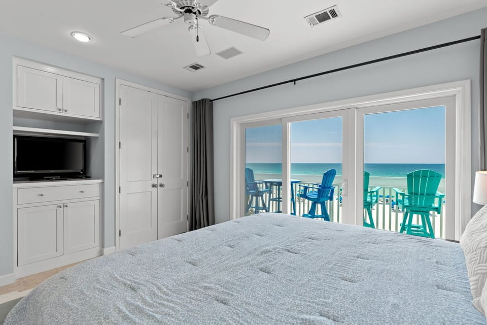 Wake up to stunning ocean views from your comfortable bed, with colorful beachfront seating just steps away on your private balcony.