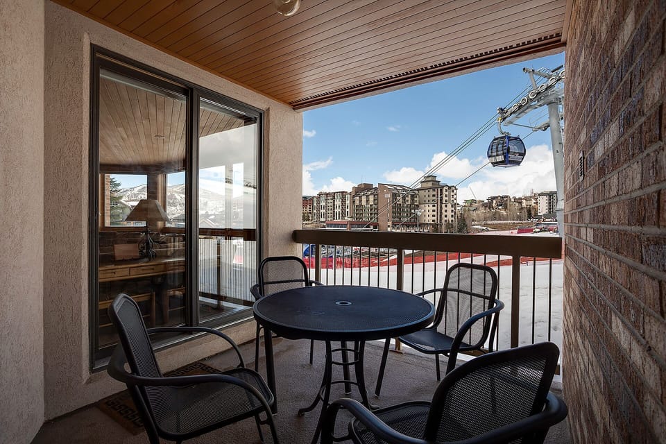 Your private balcony offers ski slope views and fresh mountain air, with comfortable seating for morning coffee or evening relaxation.