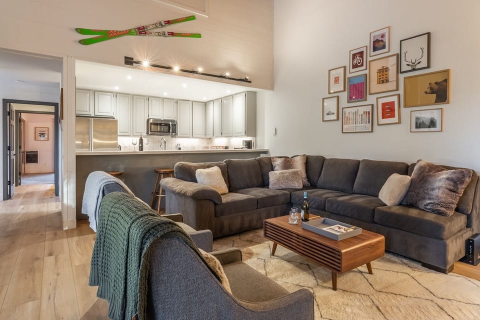 Sink into this cozy sectional sofa where your group can gather after mountain adventures, surrounded by thoughtful decor.