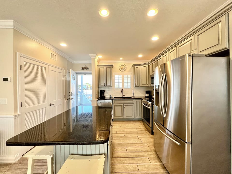 Your fully equipped kitchen features granite counters, stainless appliances, and everything needed for memorable meals during your stay.