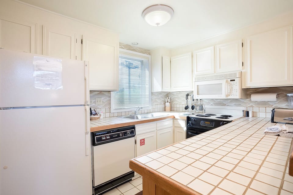Your fully equipped kitchen awaits with everything needed to prepare memorable meals during your stay.