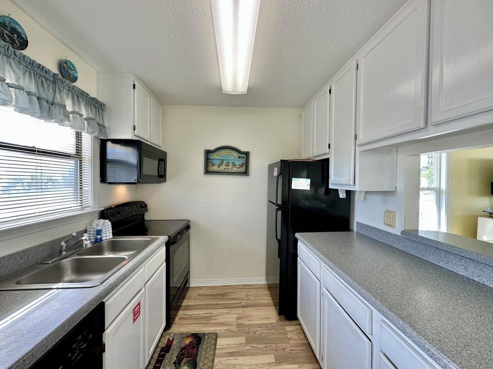 Your fully equipped kitchen features modern appliances and ample counter space for preparing memorable meals during your stay.