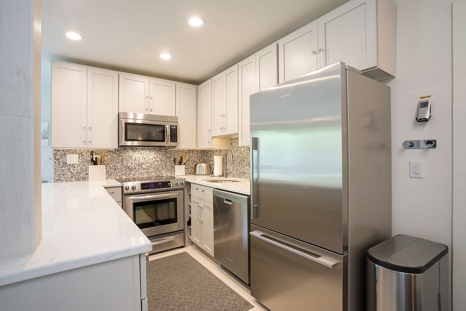 Your fully equipped kitchen features stainless steel appliances, granite countertops, and ample cabinet space for all your culinary adventures.