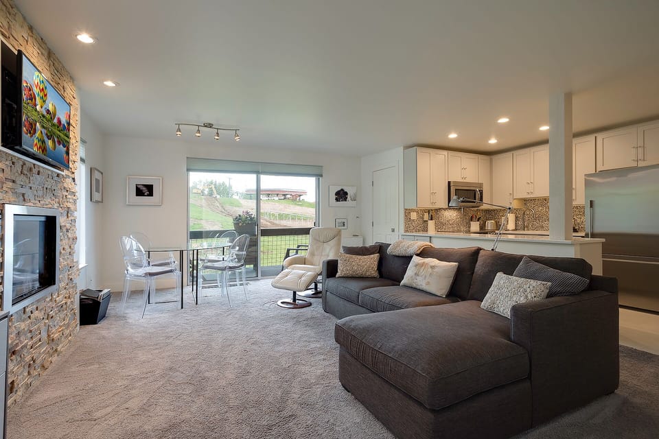 Sink into this plush sectional sofa while your fireplace crackles and your fully-equipped kitchen awaits your culinary adventures.